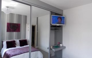 Fitted Bedroom Furniture 13 grey mirrored custom sliding door wardrobe