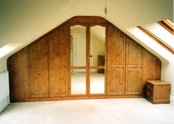 knotty pine wardrobe with hinged doors custom fitted into a sutton coldfield home