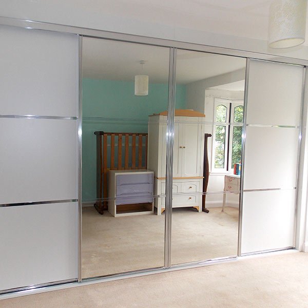 white panels, chrome and mirrored sliding door wardrobe