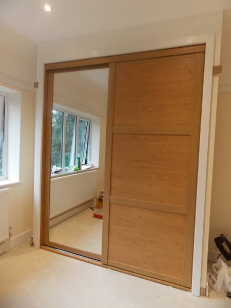 beautiful shaker style pine effect sliding door wardrobe with mirrored door