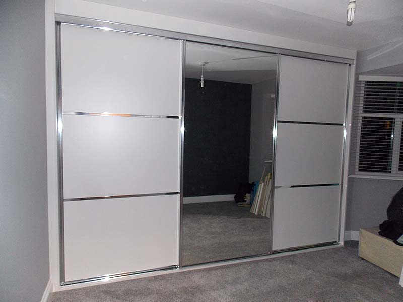 beautiful chrome and white mirrored sliding wardrobe